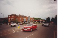 Photograph of Holtspur Service Station with the flats on the corner, taken from the roundabout in 1997.